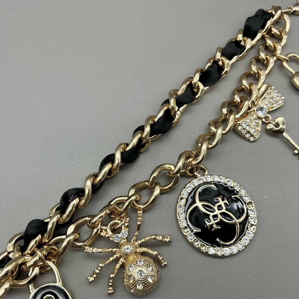 Guess Bracelet Gold Tone Black Enamel Crystal Spider Logo Charm‎ Womens Fashion - Picture 6 of 8